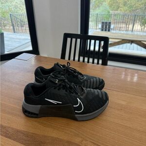 Nike women’s Metcons Black and Gray Training Sneakers